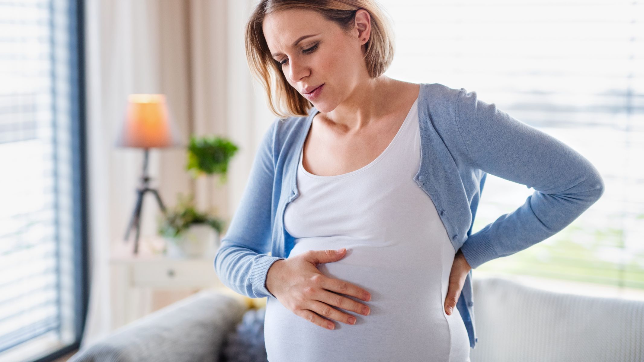 Đau lưng và đau bụng dưới khi mang thai tháng đầu: Những điều mẹ bầu nên biết 2